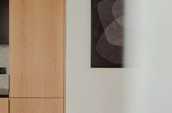 The wall is decorated with a graphic by Karol Pomykała