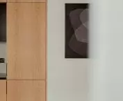 The wall is decorated with a graphic by Karol Pomykała