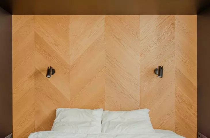 The bed headrest is also made of wood