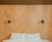 The bed headrest is also made of wood