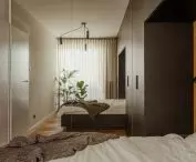 Inside the bedroom, a mirror enlarges the space