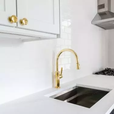 White tiles blend perfectly with gold elements