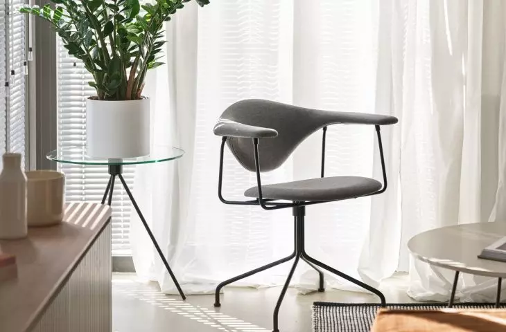 The small space of the living room is filled with furniture of modern forms