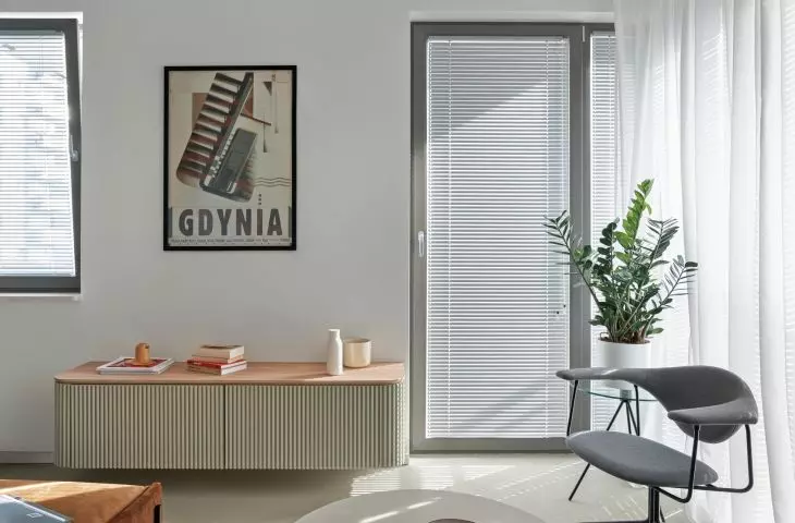The living room is decorated with an elegant custom-made dresser