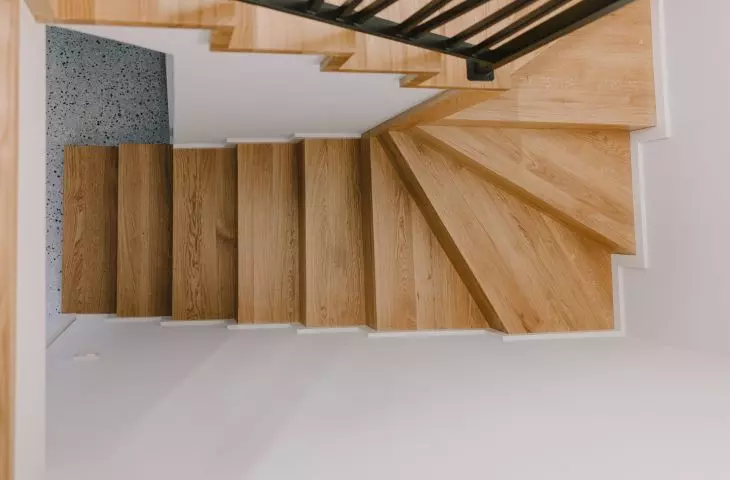 A wooden staircase leads upstairs