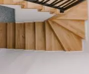 A wooden staircase leads upstairs
