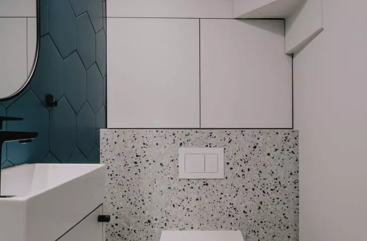 There is a small toilet under the stairs