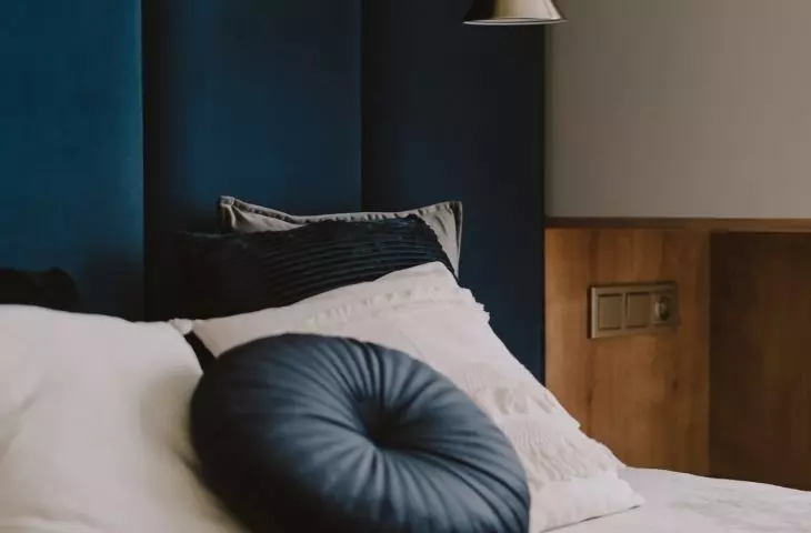 Upholstered panels behind the bed