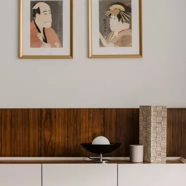 in the living room, a dresser with a fabric structure also catches the eye