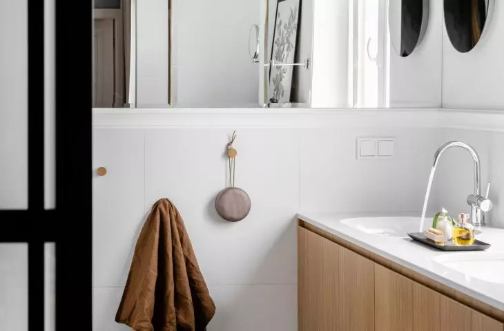 The bathroom is a juxtaposition of many materials and forms