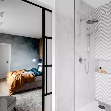 The bathroom is a juxtaposition of many materials and forms