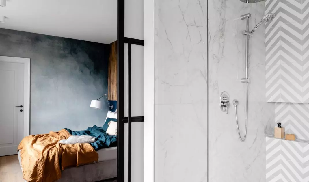The bathroom is a juxtaposition of many materials and forms