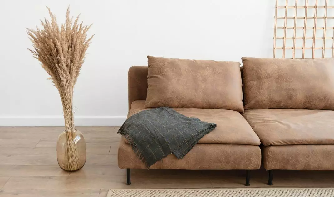 Brown sofa will look perfect in boho style interior