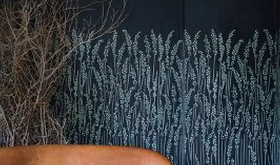 Dark wallpaper will be the perfect backdrop for leather furniture
