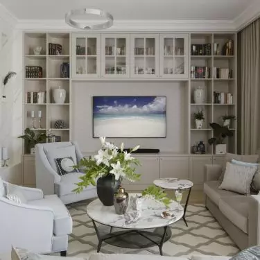 Placing bookcases around the TV will create a place to store all the things we need