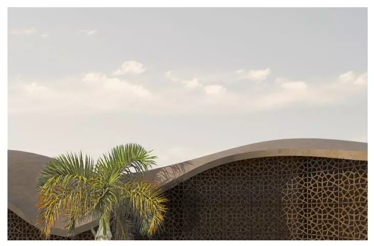 The walls are made of clay, and the openwork refers to the local culture