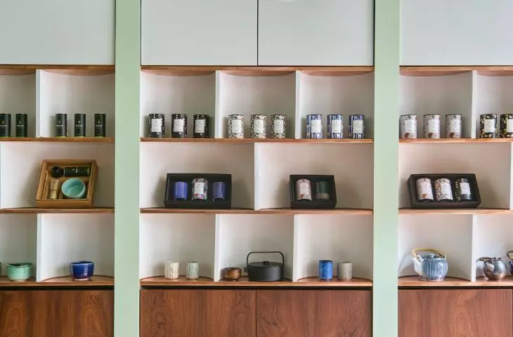 the eye is attracted by regular, rhythmic arches into which the shelves displaying available products have been inscribed