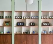 the eye is attracted by regular, rhythmic arches into which the shelves displaying available products have been inscribed