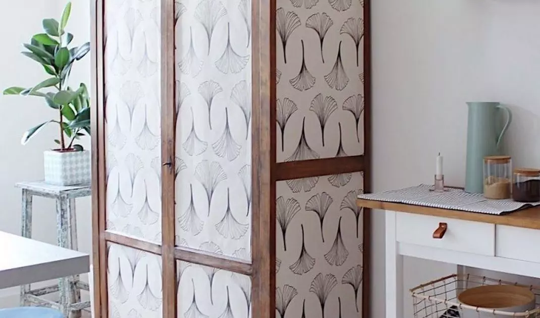 Decorate the cabinet panels with wallpaper