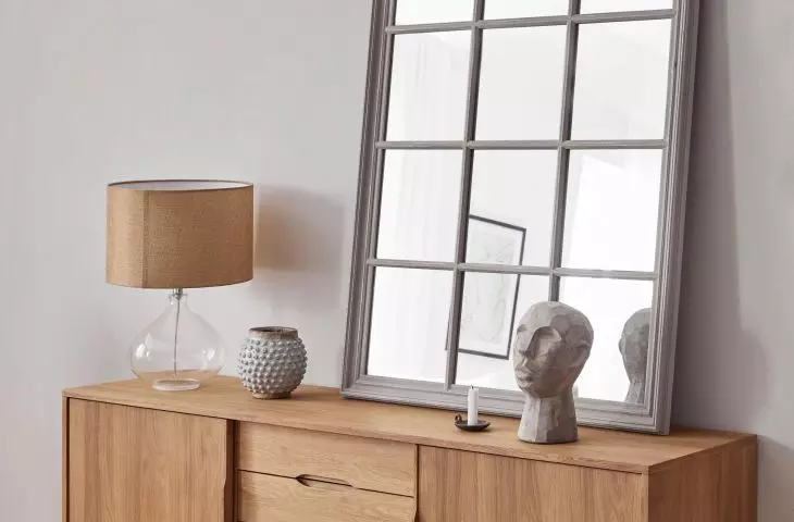 A large mirror will be an interesting addition to the subdued styling 