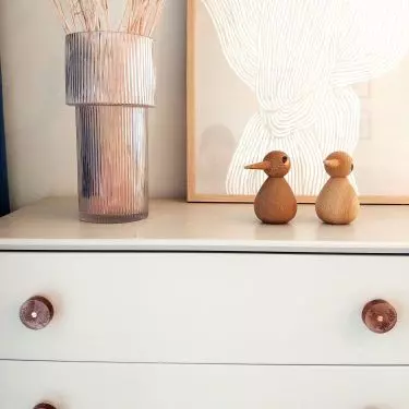 Colorful knobs will liven up a white dresser 