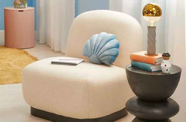 The shell-shaped pillow will be a perfect addition to the nautical style