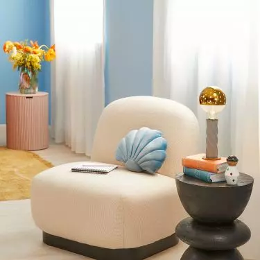 The shell-shaped pillow will be a perfect addition to the nautical style