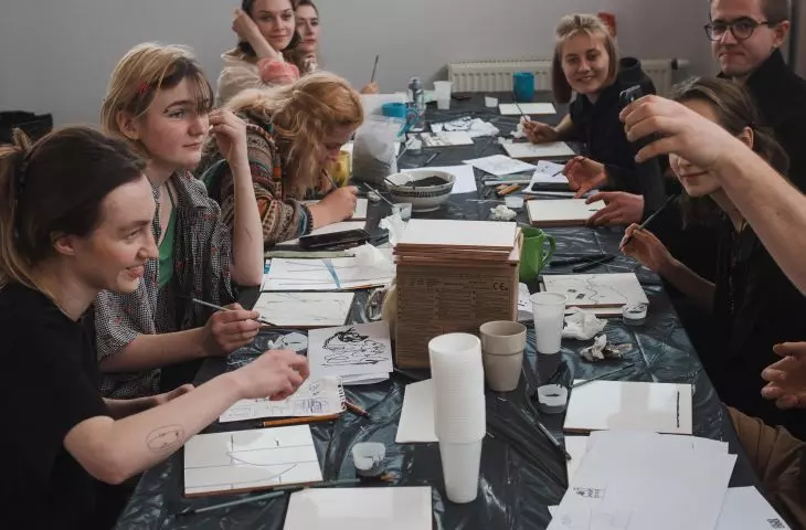 Project participants during the creation of their mosaics