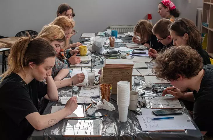 Project participants during the creation of their mosaics
