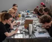 Project participants during the creation of their mosaics