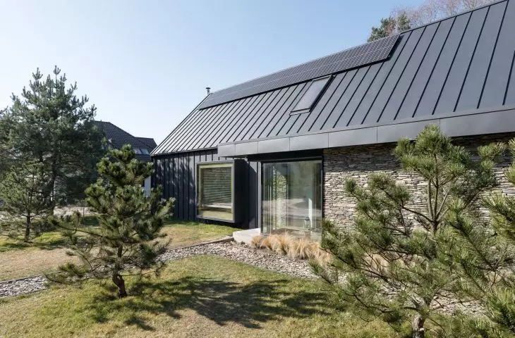 Facade is sheet metal and natural stone