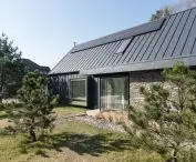 Facade is sheet metal and natural stone