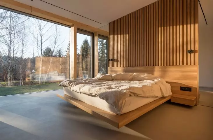 The master bedroom is dominated by wood