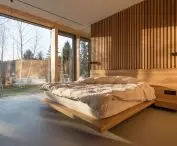 The master bedroom is dominated by wood