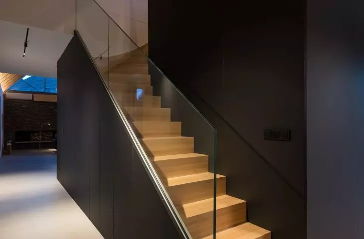 Stairs located behind the black box lead to the attic