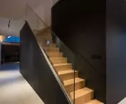 Stairs located behind the black box lead to the attic