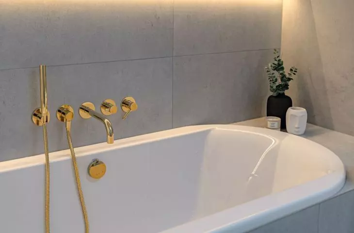 Warm LED backlights are placed above the bathtub