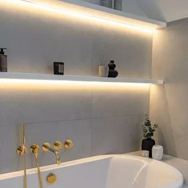 Warm LED backlights are placed above the bathtub