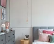 Behind the bed is English paneling