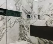 The bathroom is filled with Calacatta marble