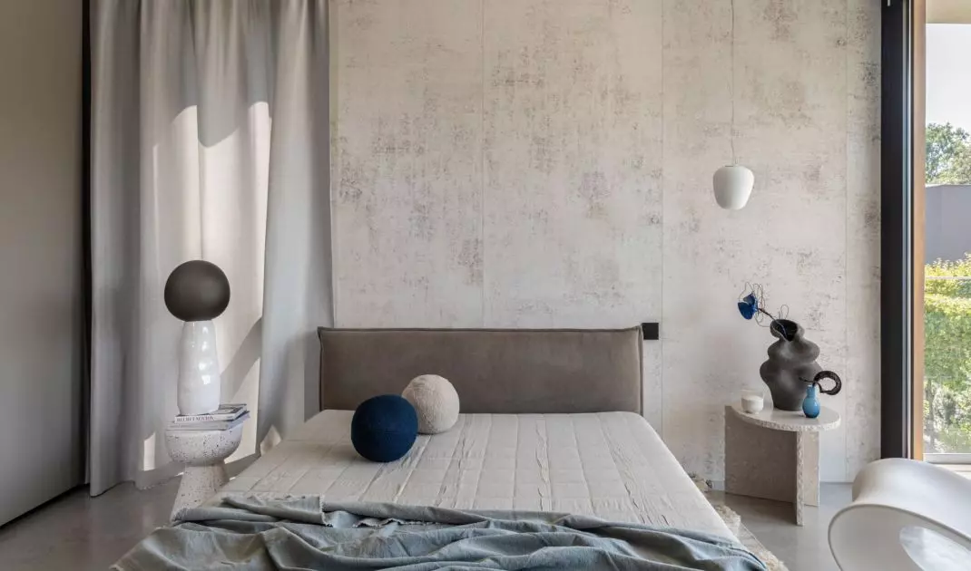 The interior of the bedroom is very minimalist and austere