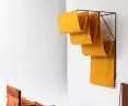 Bedspread, rugs, bolsters, backing - architectural clothing in warm tones for the cold seasons