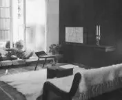 A bedspread wrapping furniture and a section of floor in a lounge; Polish Pavilion in Paris, 1937