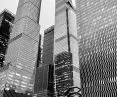 Vessel among glass skyscrapers