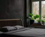 architects used black clay plaster in the bedroom