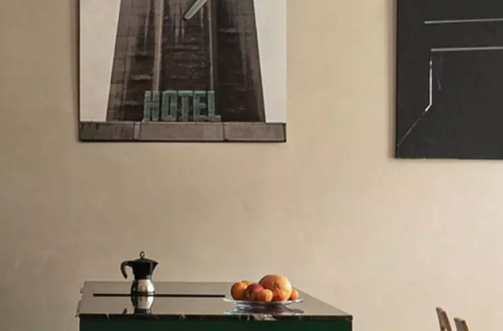 An island between the kitchen and dining room