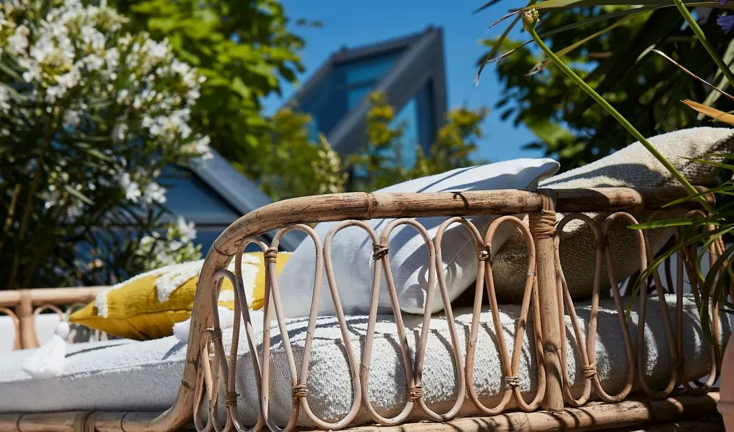 Bamboo daybeds that bring to mind colonial mansions in the Caribbean