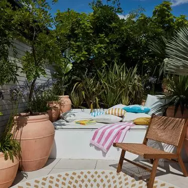 Lounge furniture is decorated with a mass of colorful cushions
