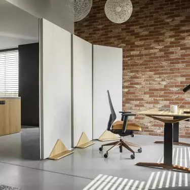 A screen separating the work area from the kitchen area