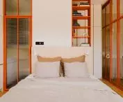 orange accents in a bright bedroom